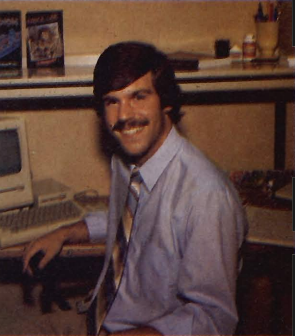 A picture of Ron J. Fortier in his office, ca. 1984